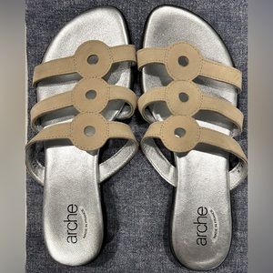 Soft silver shiny insoles. Suede feeling exterior tan in color, light weight.